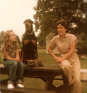 Dog on picnic table with cat and family - 1980's - thetemenosjournal.com