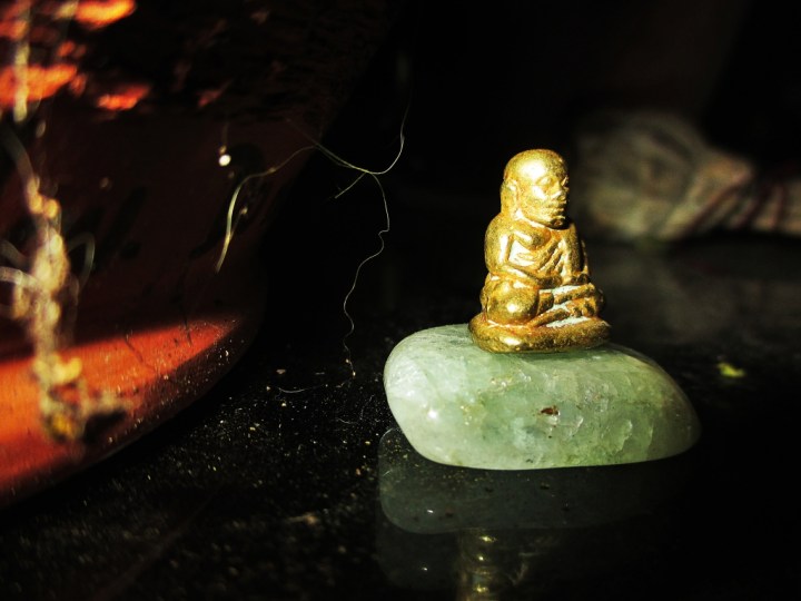 Buddha On A Rock