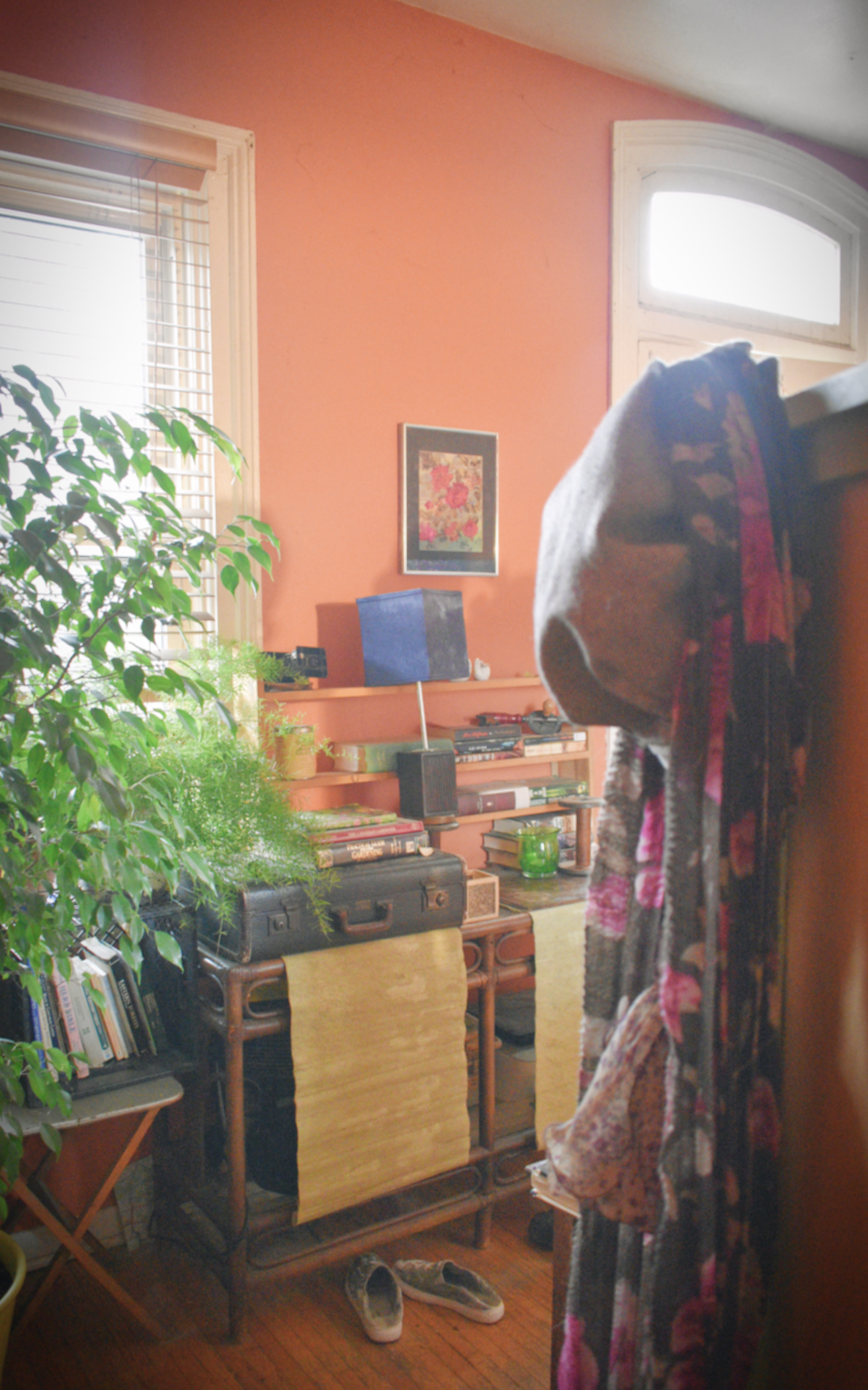 boho entranceway with orange walls - thetemenosjournal.com