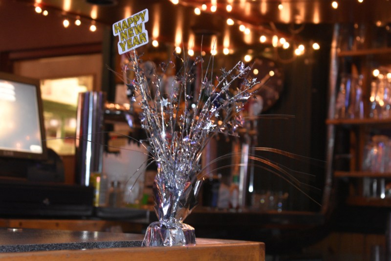 Happy New Years decor at a bar - thetemenosjournal.com
