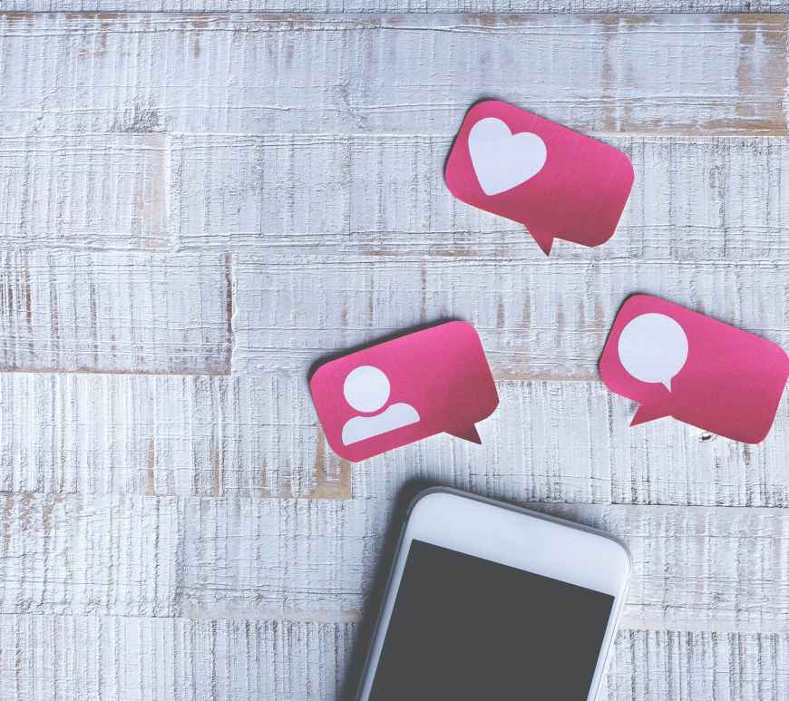 white smartphone with social media icons